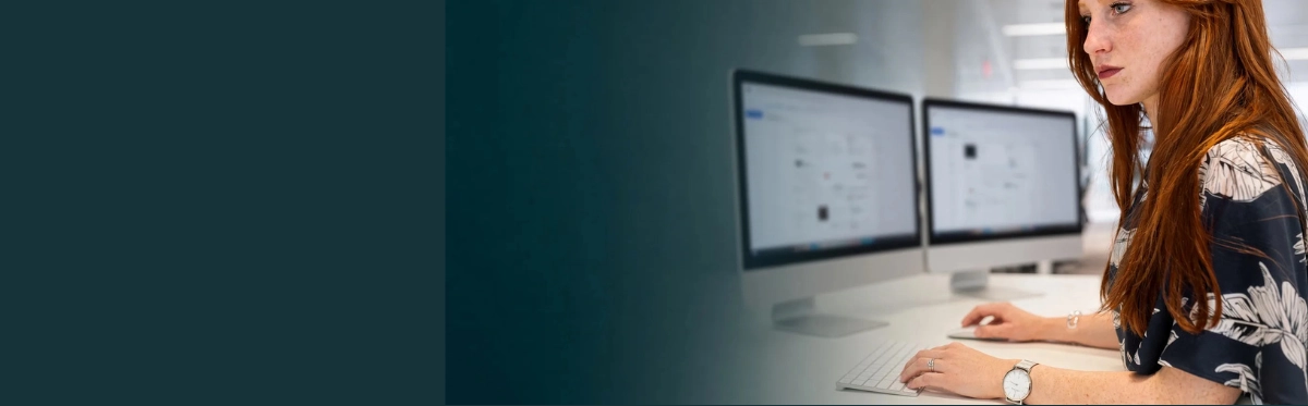 Focused professional woman working at computer